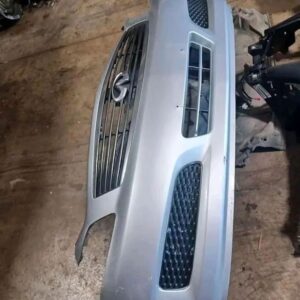 Infiniti G35 sedan front bumper with grill and emblem.