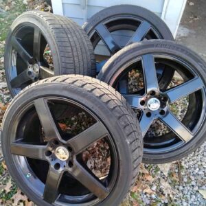a set of 4 black flake aluminum TSW rims.