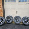 a set of 4 Tesla Model Y 20" Induction Wheels with Tires and TPMS Sensors.