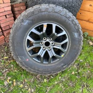 275 70R18 Tremor wheels and tires.