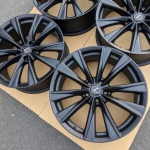 Set of four black alloy wheels for a Lexus .